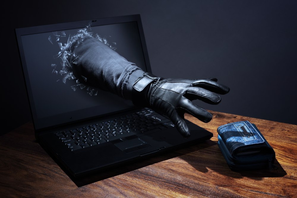 Stealing,A,Purse,Through,A,Laptop,Concept,For,Computer,Hacker,